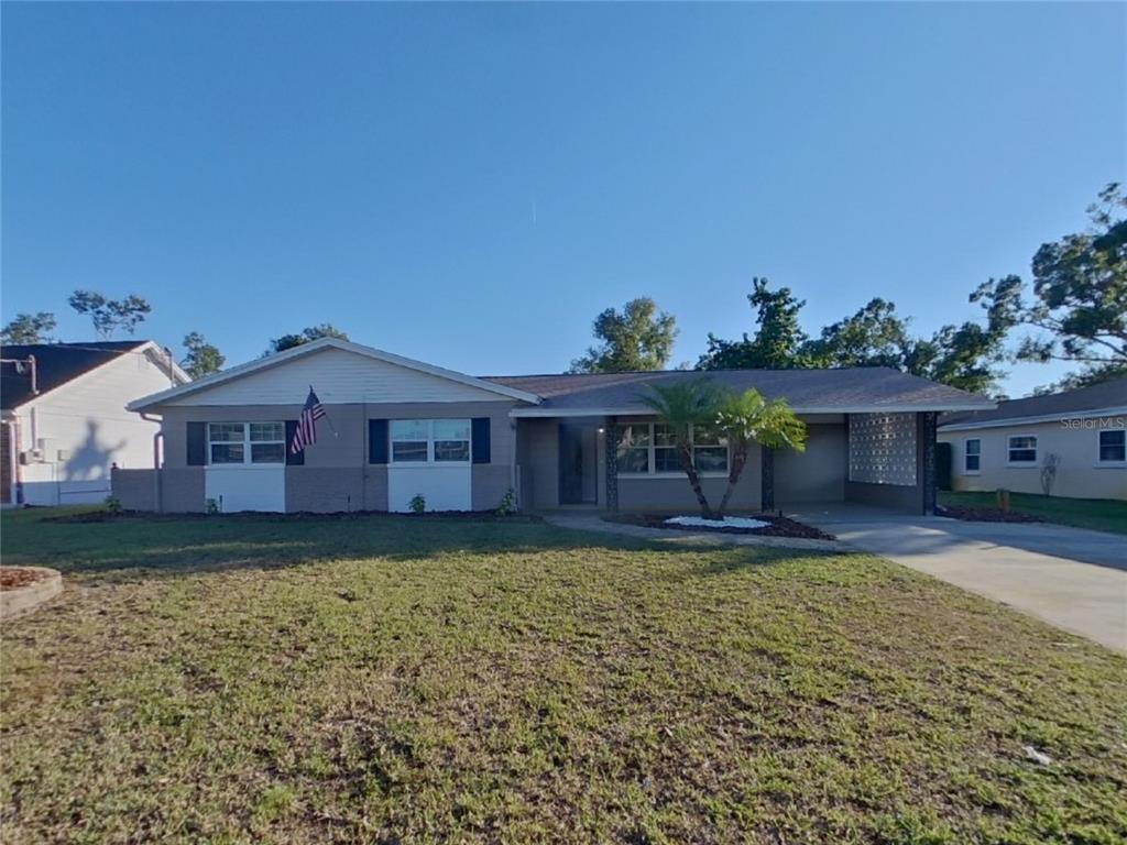 front view of a house with a yard