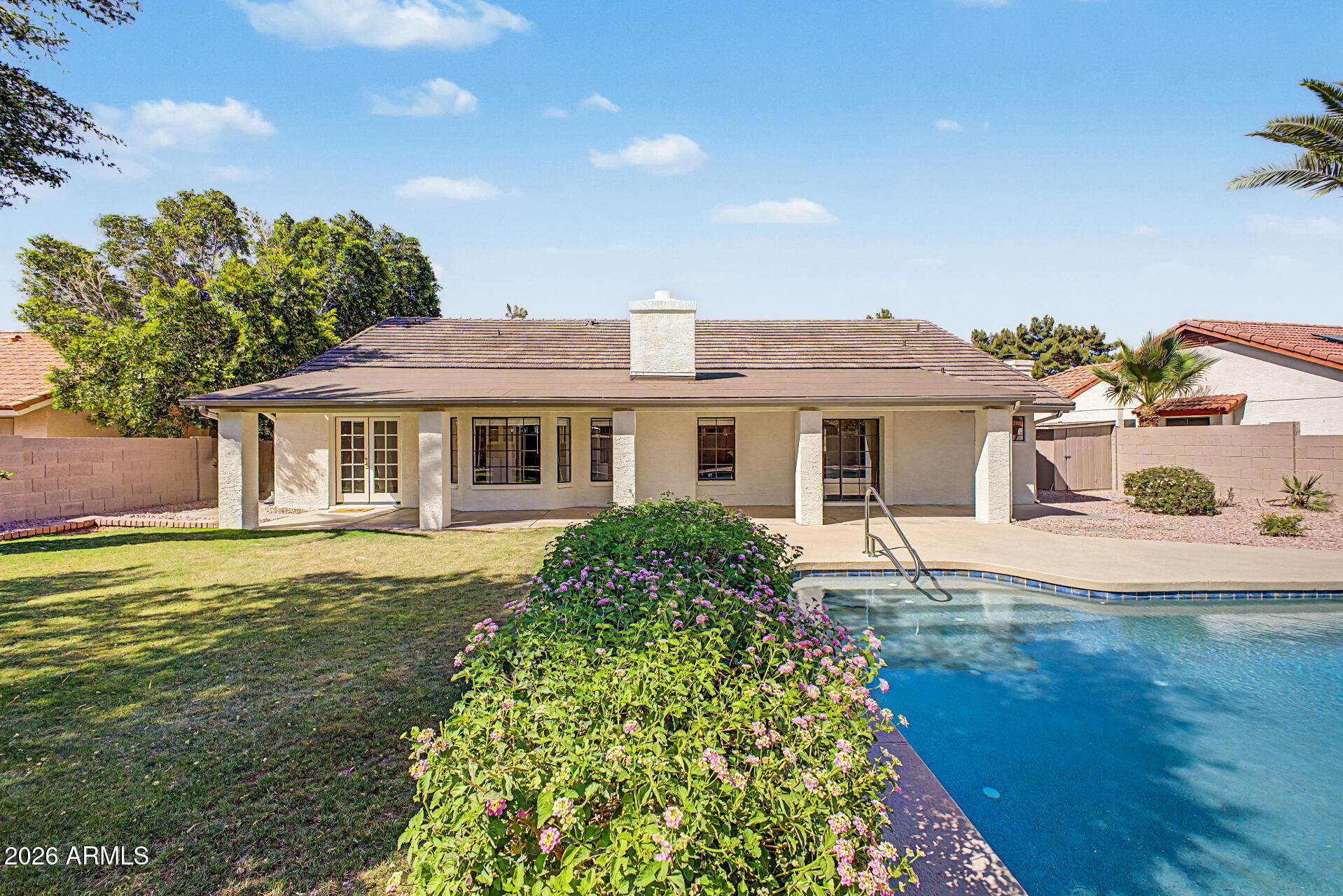 6725 West Utopia Road Glendale, AZ 85308 - Photo 24 of 27 a front view of a house with garden