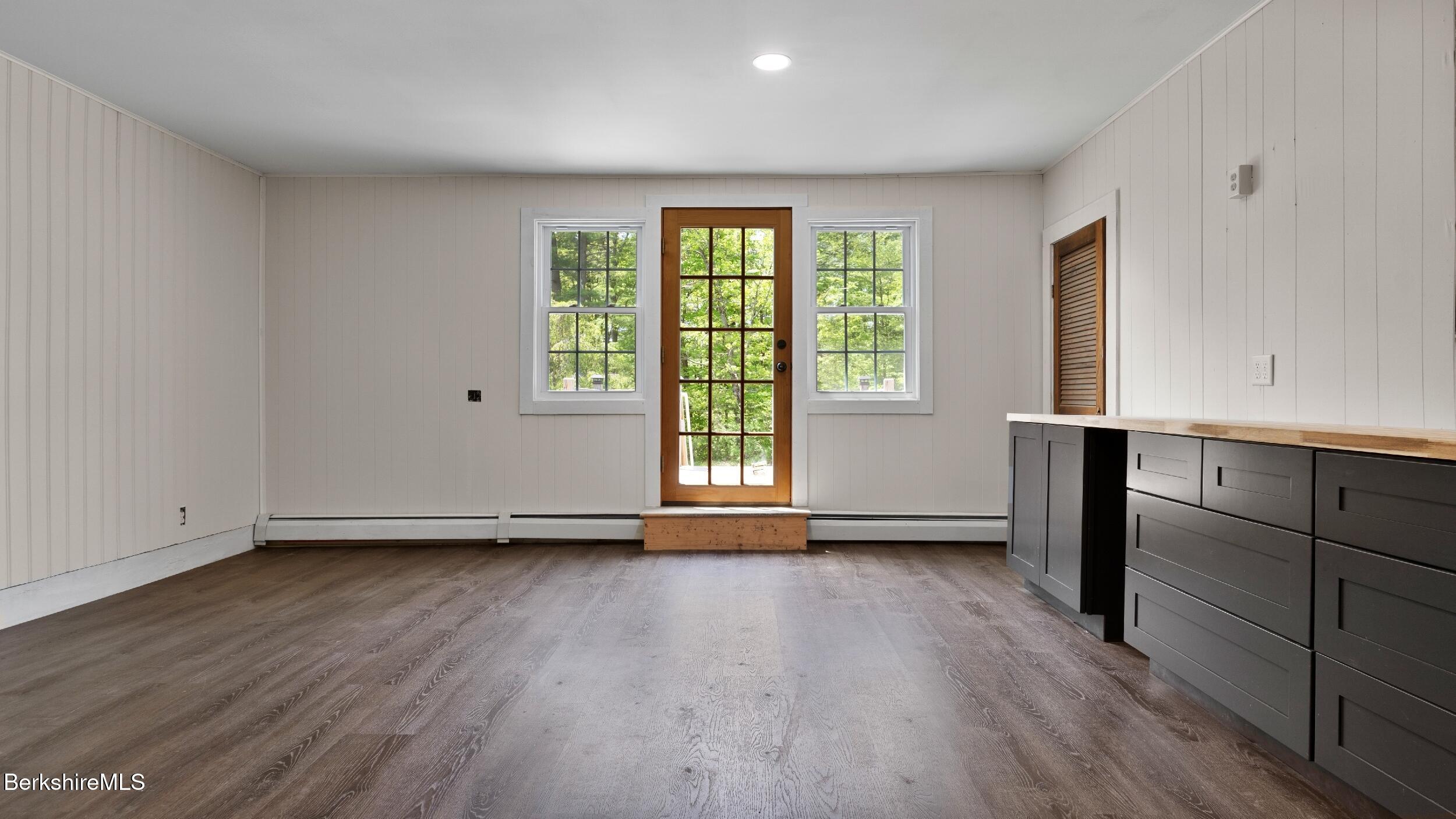 20 East Dugway Road Lenox, MA 01240 - Photo 35 of 84 a view of an empty room with wooden floor and a window