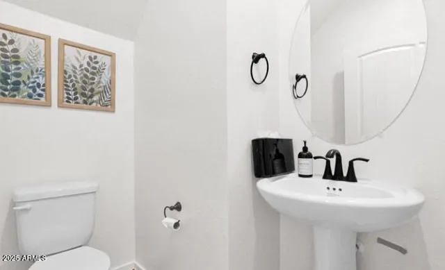 a bathroom with a sink and mirror