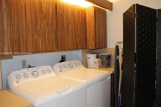 a utility room with dryer and washer