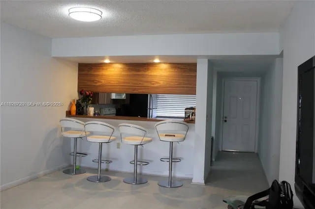 a view of a room with chairs and tables