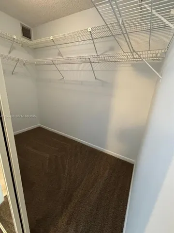 a view of a room with racks on the wall