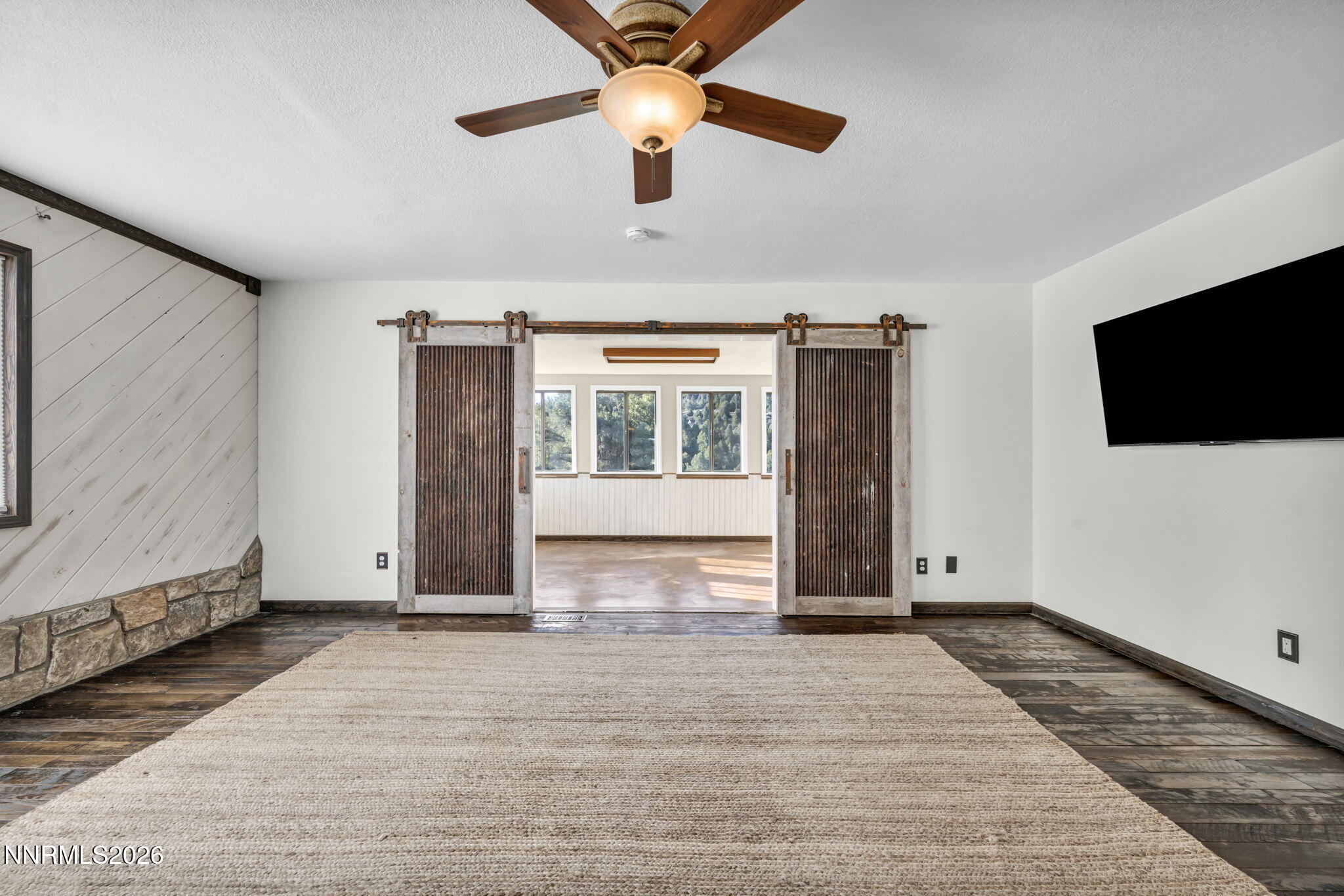 1835 Lousetown Road Reno, NV 89521 - Photo 23 of 60 a view of livingroom with hardwood floor and ceiling fan