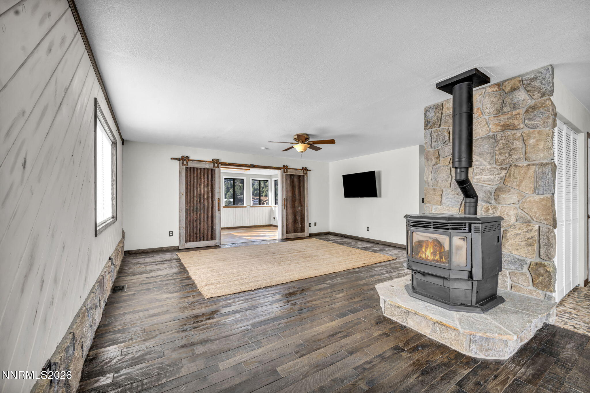 1835 Lousetown Road Reno, NV 89521 - Photo 26 of 60 a view of a livingroom with wooden floor and fireplace