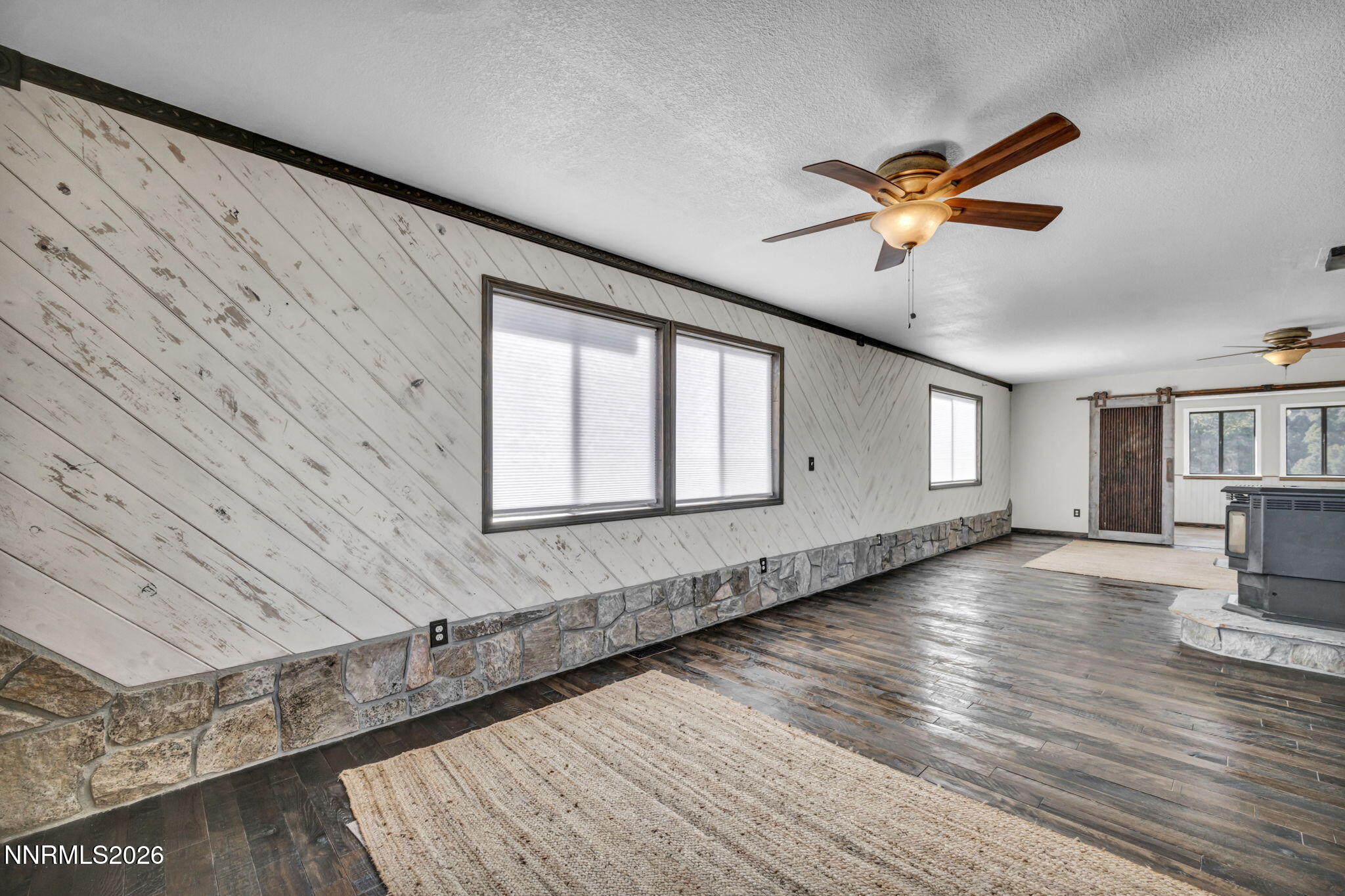 1835 Lousetown Road Reno, NV 89521 - Photo 30 of 60 a view of empty room with wooden floor and fan