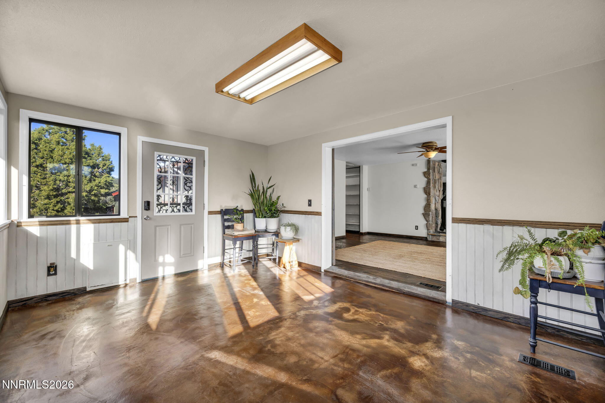 1835 Lousetown Road Reno, NV 89521 - Photo 31 of 60 a view of a room with furniture and a potted plant