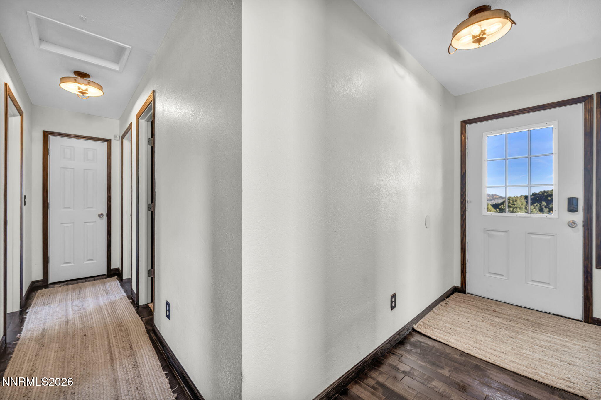 1835 Lousetown Road Reno, NV 89521 - Photo 43 of 60 a view of a hallway with wooden floor