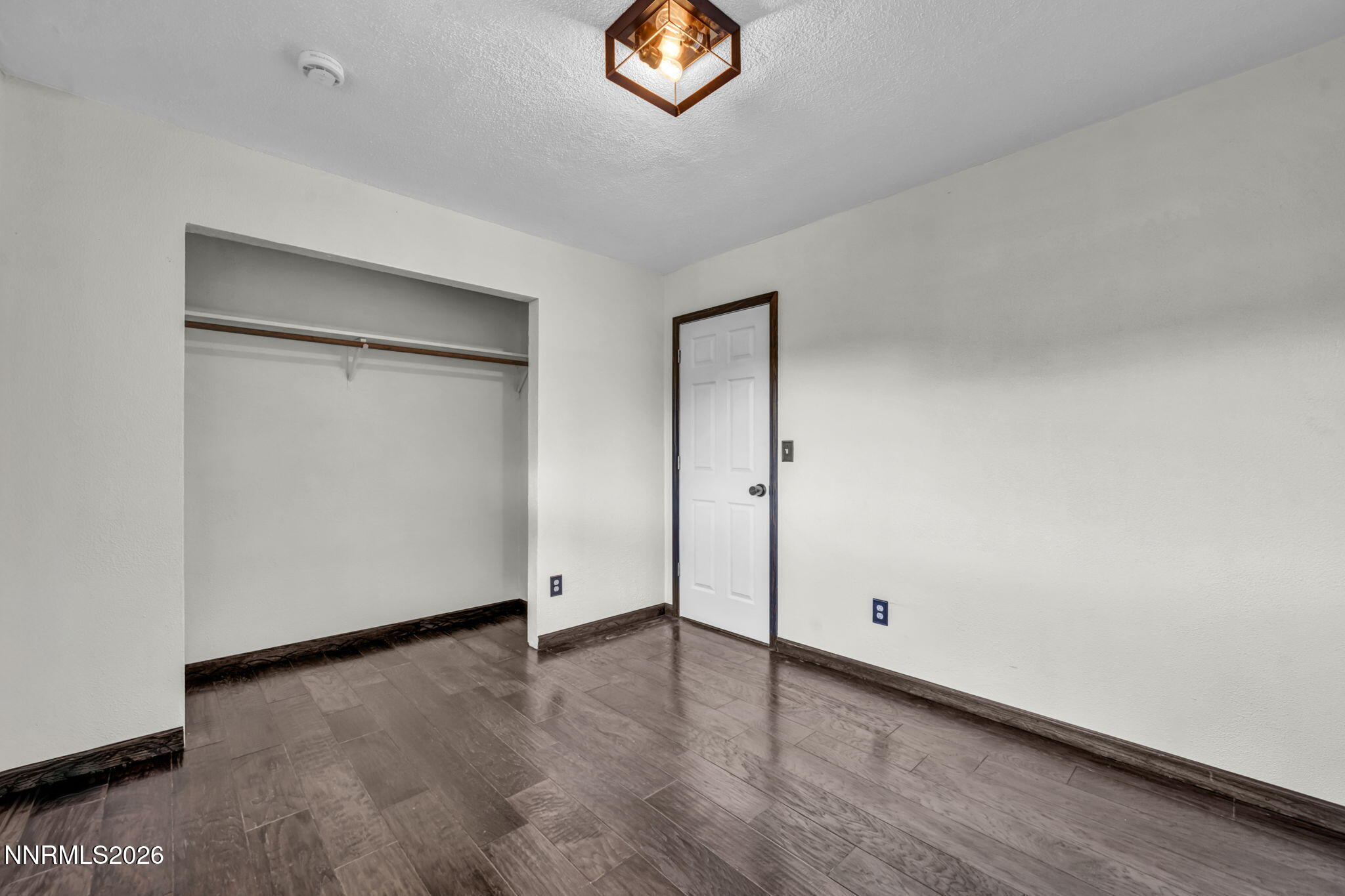 1835 Lousetown Road Reno, NV 89521 - Photo 45 of 60 an empty room with wooden door and windows