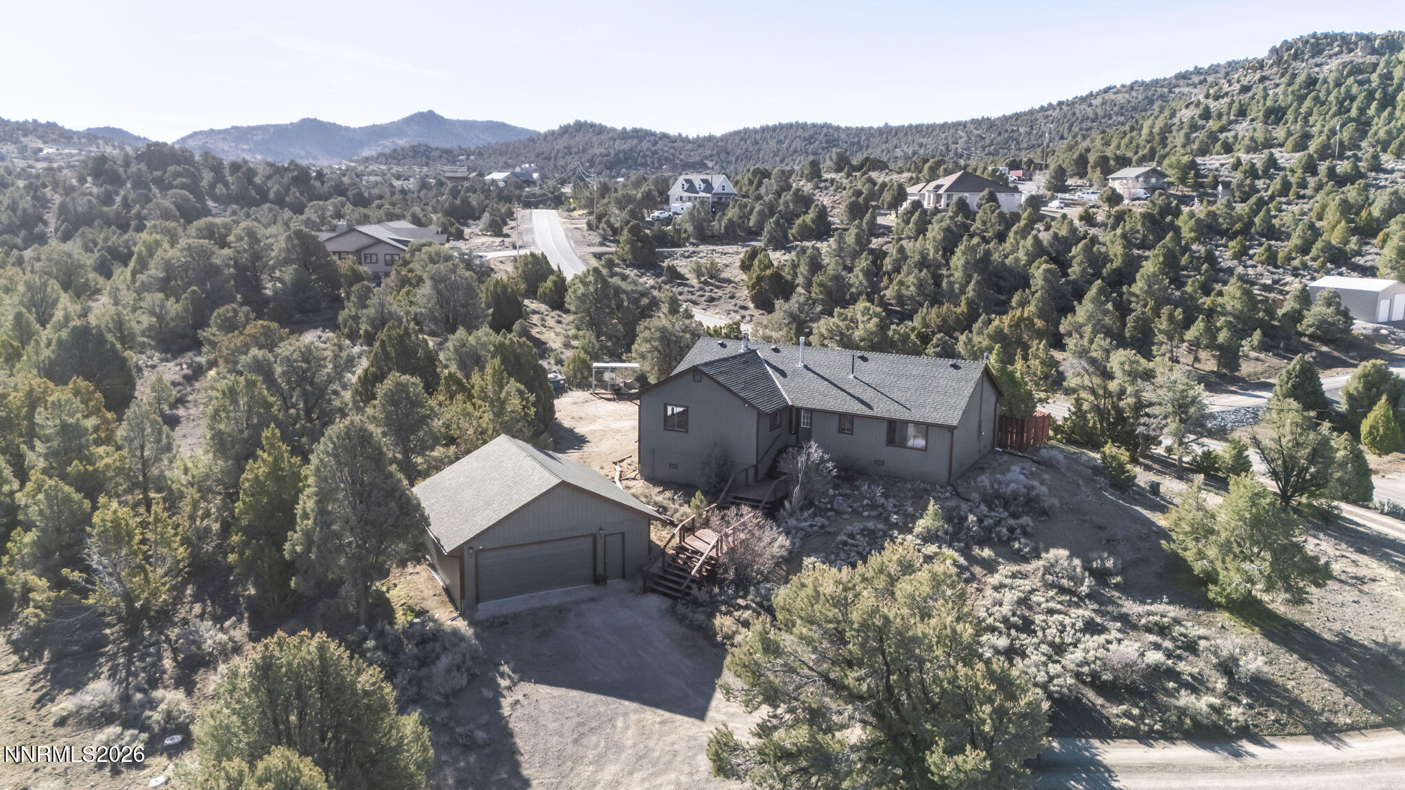 1835 Lousetown Road Reno, NV 89521 - Photo 8 of 60 an aerial view of a house with a mountain in the background