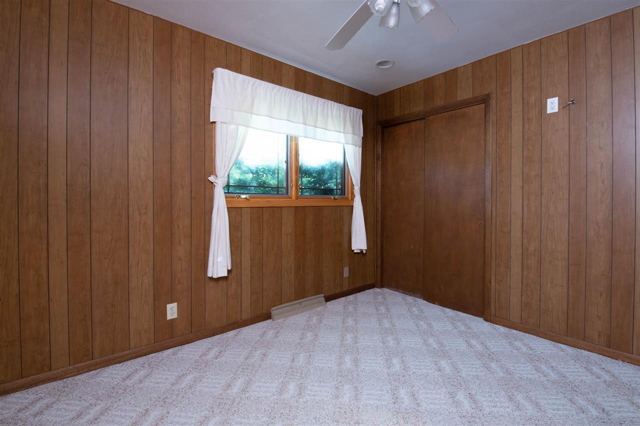 2239 Breckenboro Road Davis, IL 61019 - Photo 17 of 35 a view of a livingroom with wooden floor and a ceiling fan