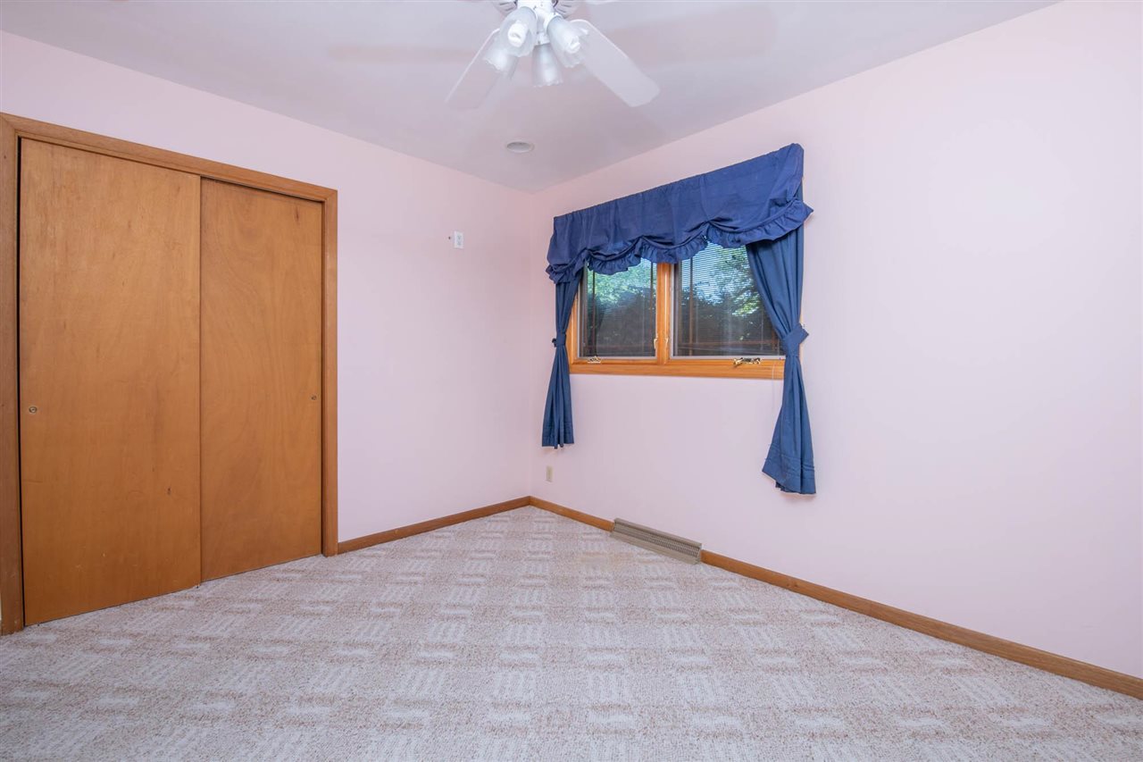 2239 Breckenboro Road Davis, IL 61019 - Photo 20 of 35 a view of an empty room with chandelier fan