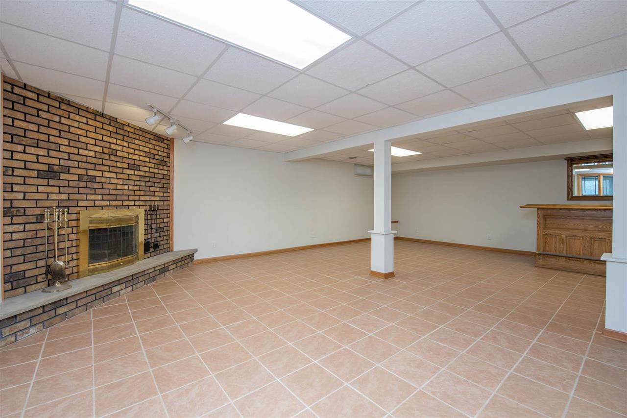 2239 Breckenboro Road Davis, IL 61019 - Photo 21 of 35 a view of an empty room with a fireplace