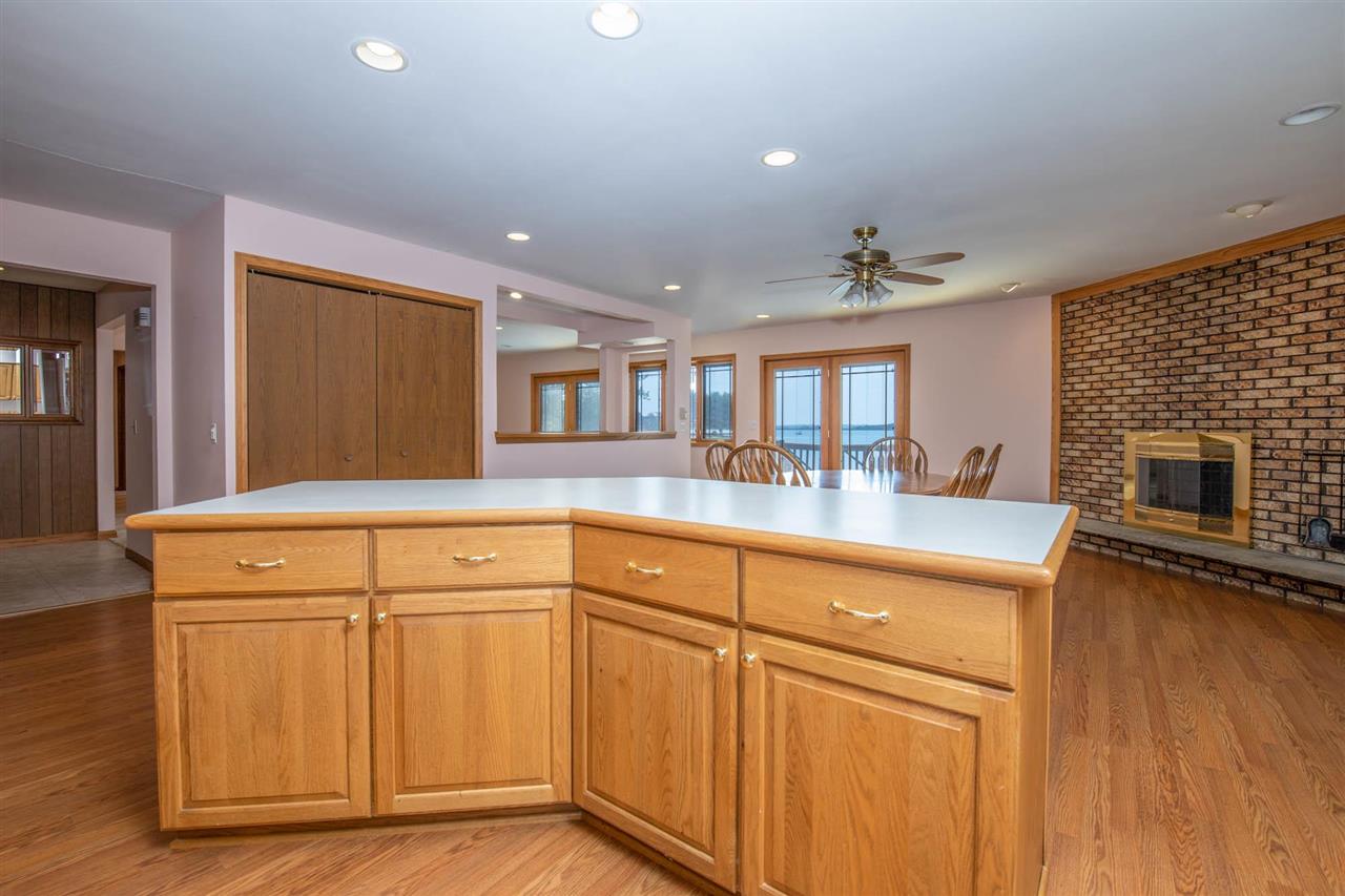 2239 Breckenboro Road Davis, IL 61019 - Photo 10 of 35 a kitchen with cabinets and a wooden floor