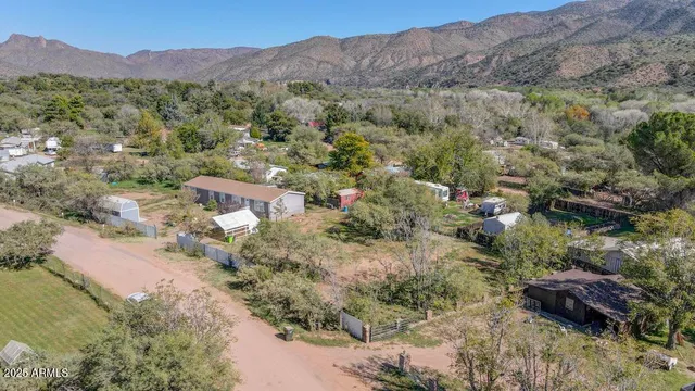 an aerial view of a houses with outdoor space