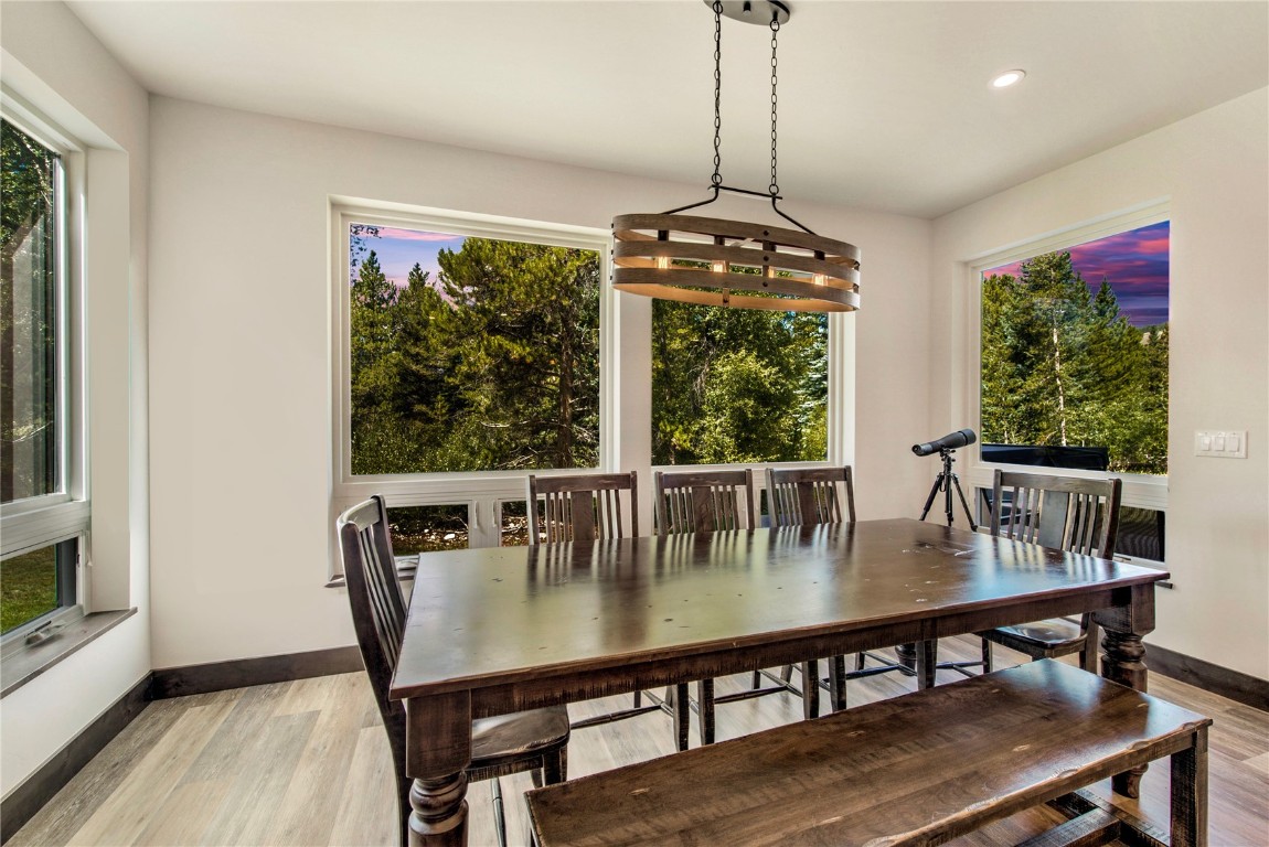 596 Fly Line Drive Silverthorne, CO 80498 - Photo 11 of 32 a view of a dining room with furniture window and wooden floor
