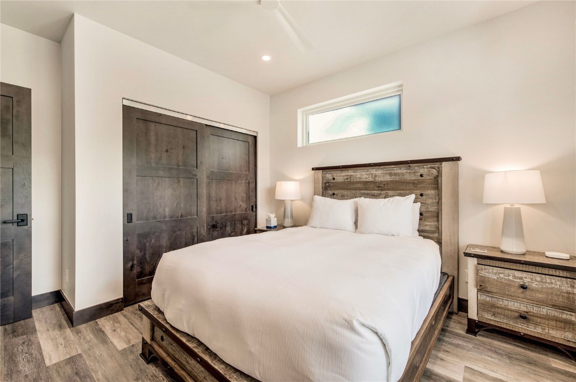 596 Fly Line Drive Silverthorne, CO 80498 - Photo 17 of 32 a bedroom with a bed and a night stand