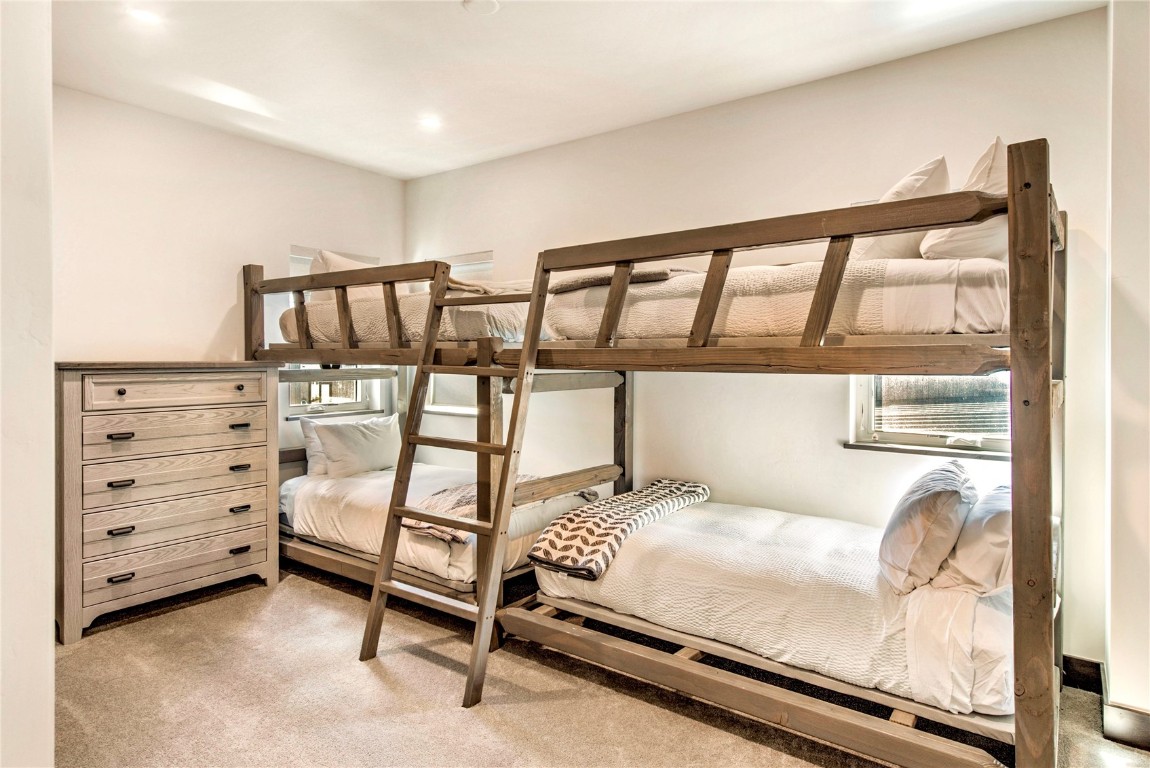 596 Fly Line Drive Silverthorne, CO 80498 - Photo 23 of 32 a bedroom with furniture and natural light