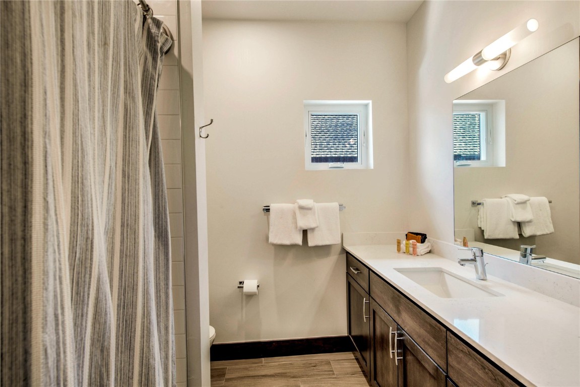 596 Fly Line Drive Silverthorne, CO 80498 - Photo 24 of 32 a bathroom with a sink and a mirror