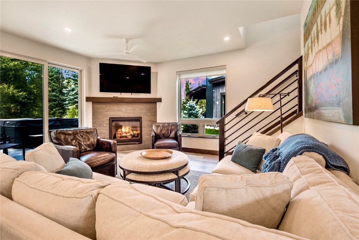 596 Fly Line Drive Silverthorne, CO 80498 - Photo 3 of 32 a living room with furniture fireplace and a large window