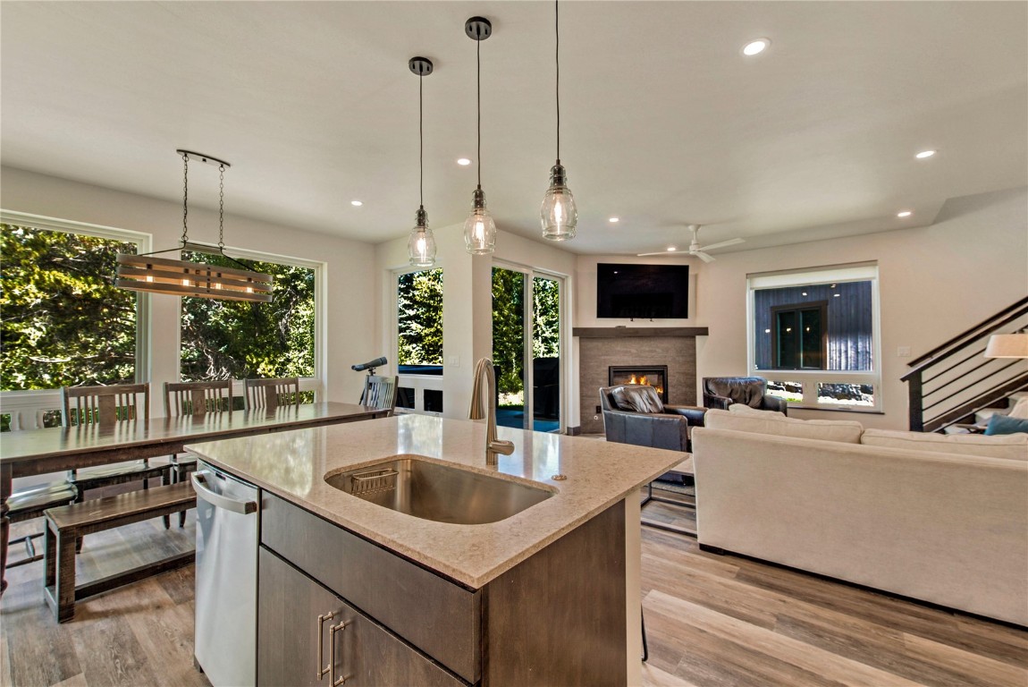 596 Fly Line Drive Silverthorne, CO 80498 - Photo 9 of 32 a kitchen with a stove a sink a counter space and living room view