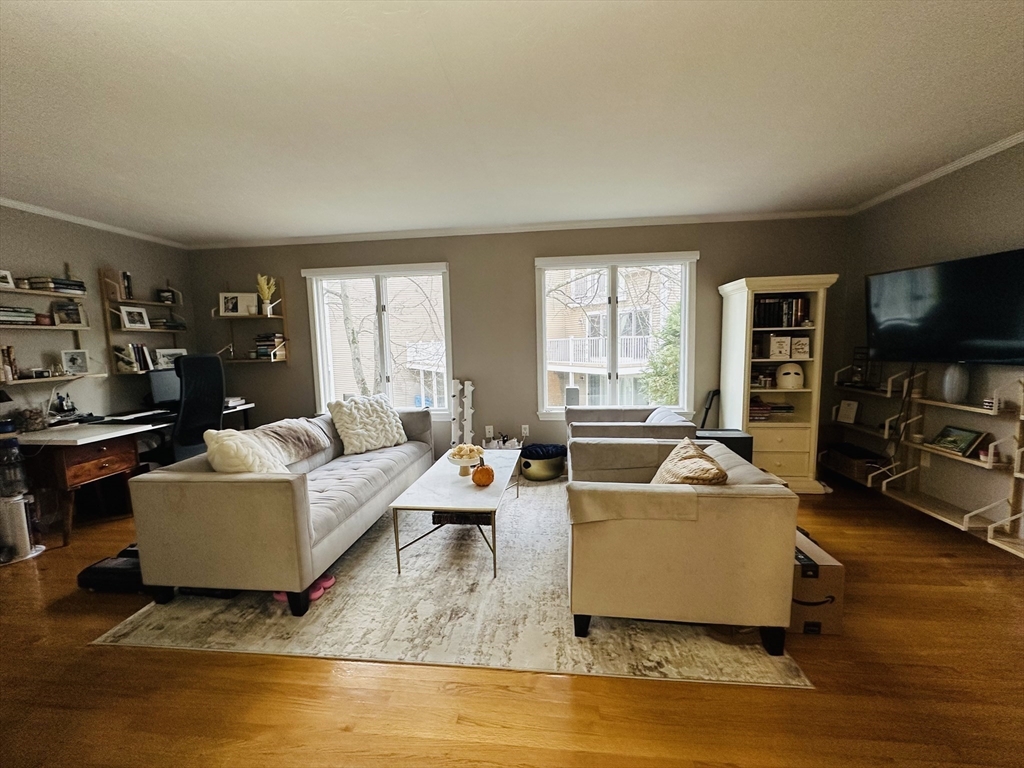 46 Pointe Rok Drive, Unit 46 Worcester, MA 01604 - Photo 9 of 23 a living room with furniture and a flat screen tv