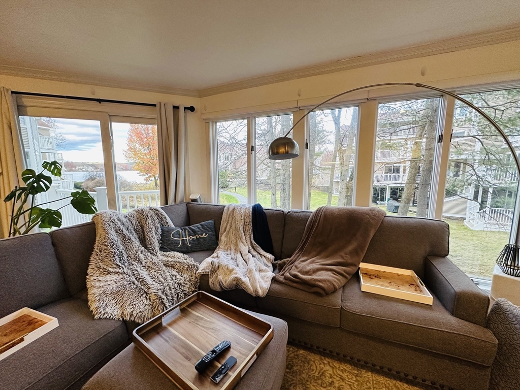 46 Pointe Rok Drive, Unit 46 Worcester, MA 01604 - Photo 10 of 23 a living room with furniture and a large window
