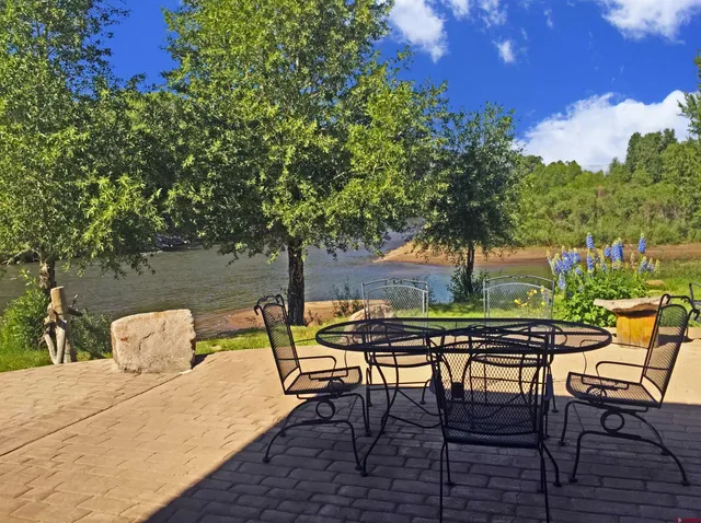 a patio with table and chairs