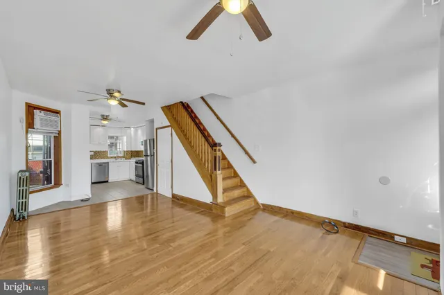 a view of an entryway with wooden floor