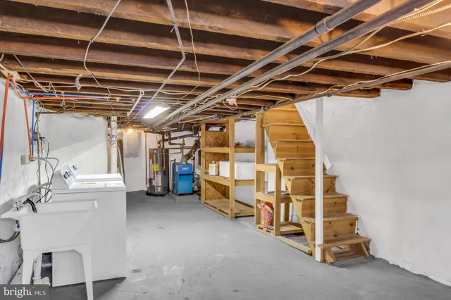 a view of storage and utility room with stairs