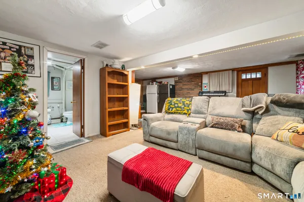 a living room with furniture and flowers