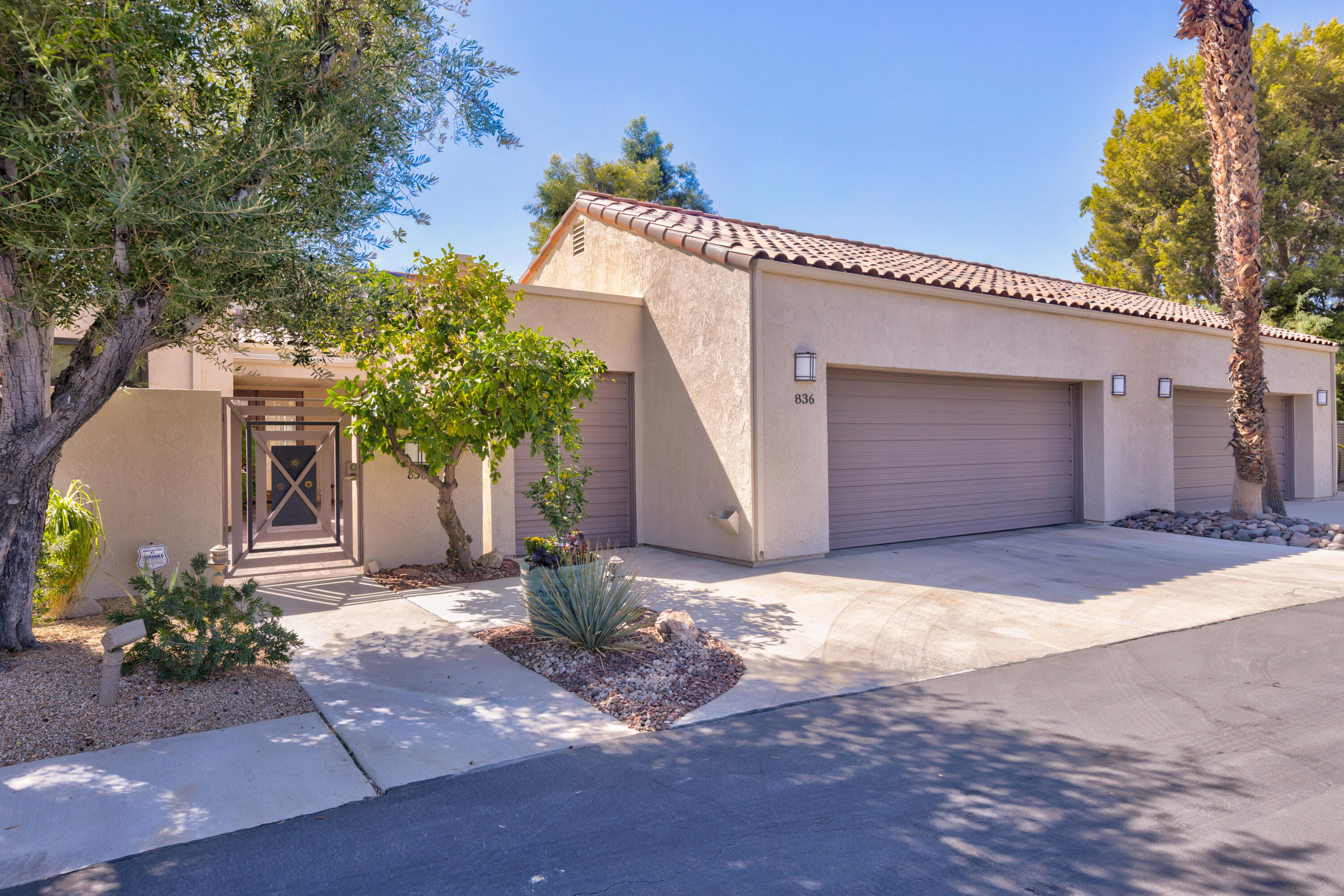 836 Inverness Drive Rancho Mirage, CA 92270 - Photo 21 of 29 a front view of a house with a yard and garage