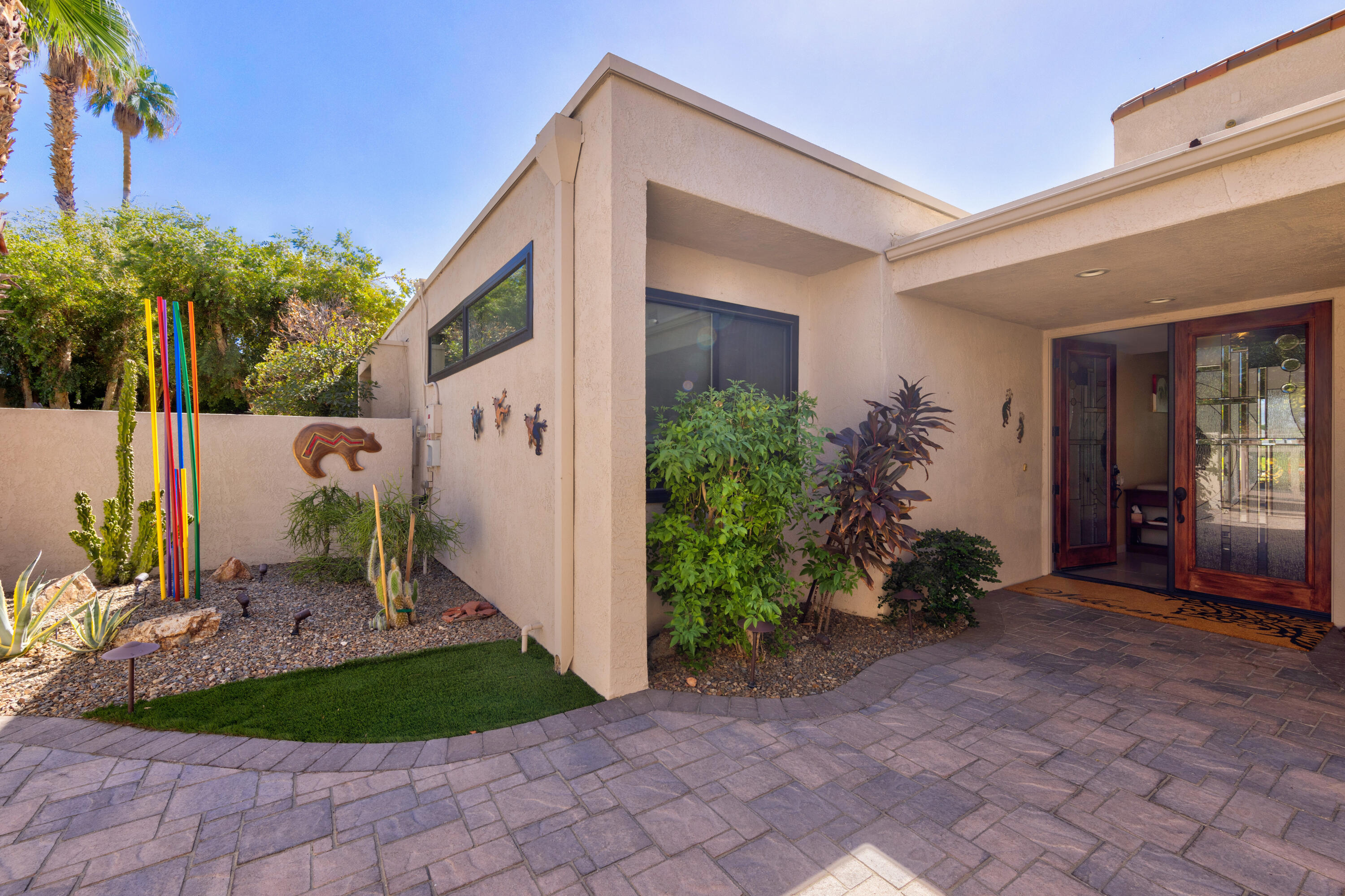 836 Inverness Drive Rancho Mirage, CA 92270 - Photo 24 of 29 a front view of a house with garden