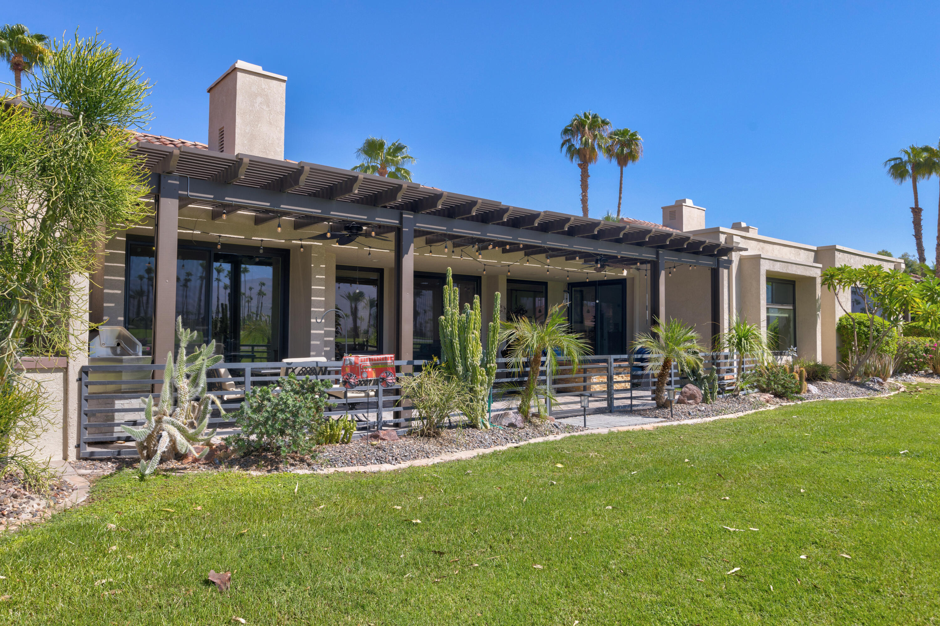 836 Inverness Drive Rancho Mirage, CA 92270 - Photo 25 of 29 a view of a house with a yard and sitting area