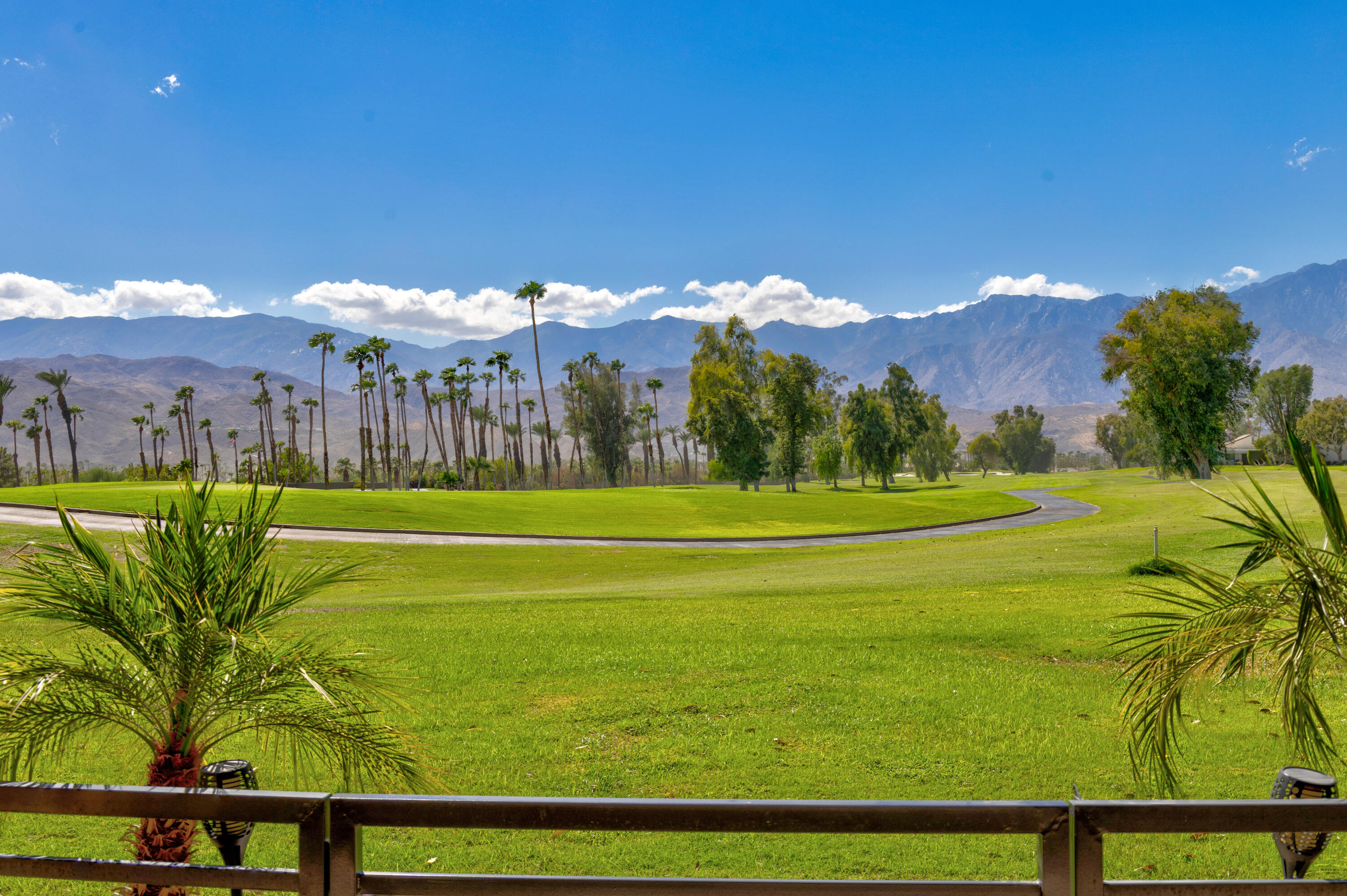 836 Inverness Drive Rancho Mirage, CA 92270 - Photo 26 of 29 a view of a golf course with a lake