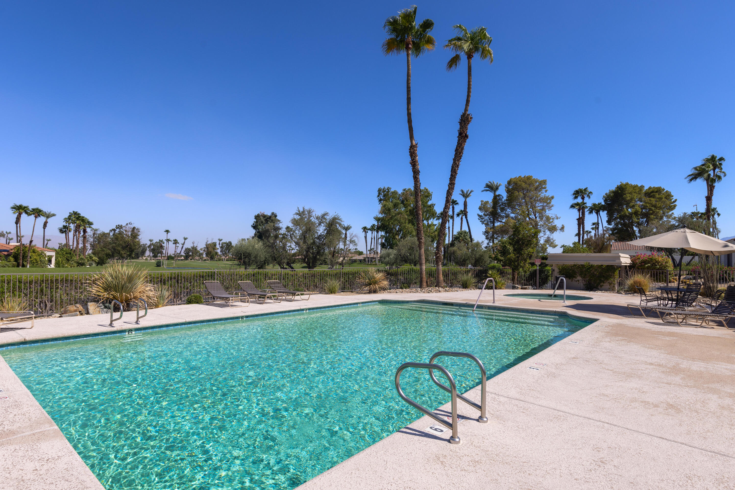836 Inverness Drive Rancho Mirage, CA 92270 - Photo 28 of 29 a view of a swimming pool and a yard