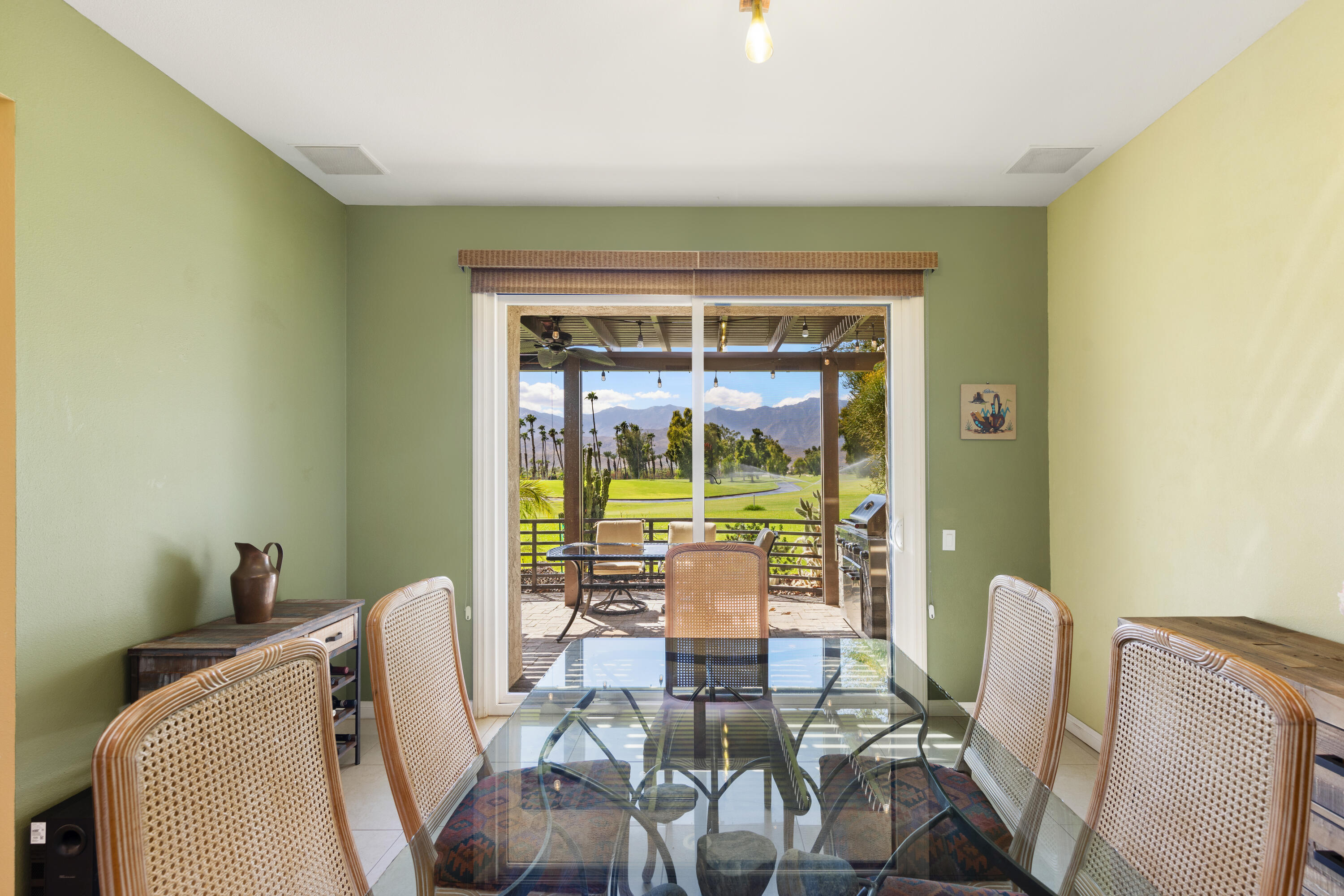836 Inverness Drive Rancho Mirage, CA 92270 - Photo 9 of 29 a dining room with furniture and a window
