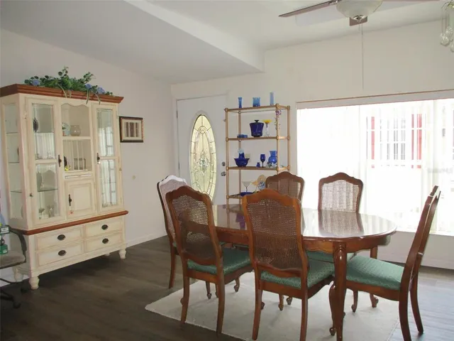 a dining room with furniture and window