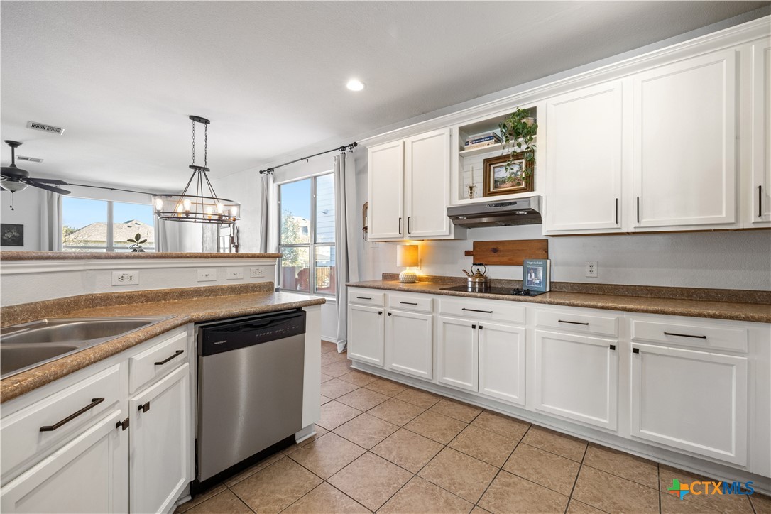 723 Tumbleweed Trail Temple, TX 76502 - Photo 13 of 38 a kitchen with stainless steel appliances granite countertop a sink and cabinets