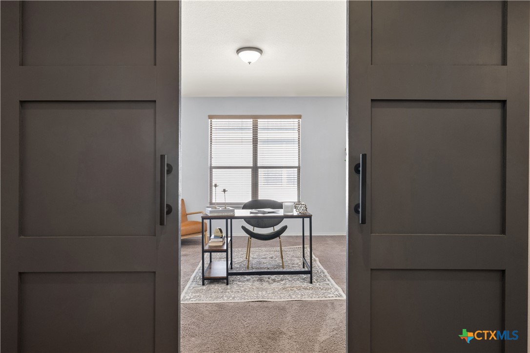 723 Tumbleweed Trail Temple, TX 76502 - Photo 24 of 38 a kitchen with a refrigerator and table