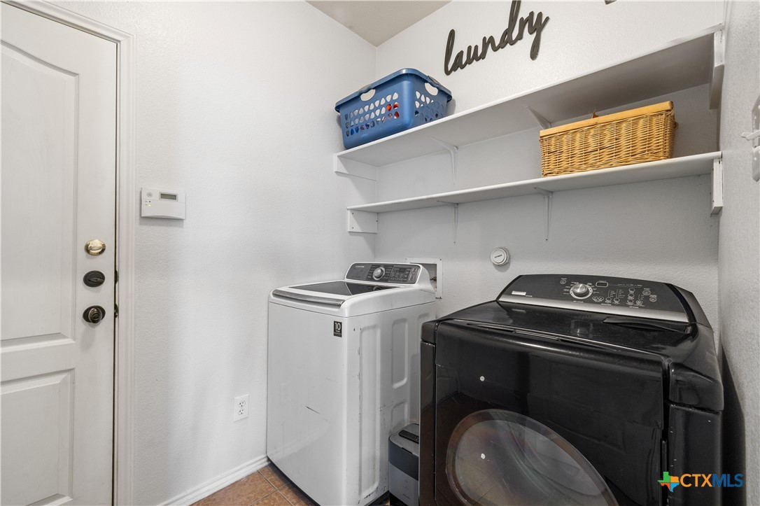 723 Tumbleweed Trail Temple, TX 76502 - Photo 28 of 38 a utility room with dryer and washer