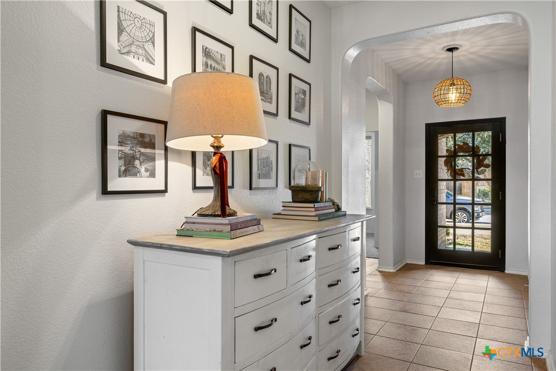 723 Tumbleweed Trail Temple, TX 76502 - Photo 3 of 38 a view of a hallway with entryway and chandelier