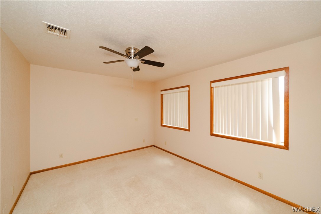 2100 East Valley View Road Kingman, AZ 86409 - Photo 29 of 53 Neutral wall paint with wood-finish trim and baseboards