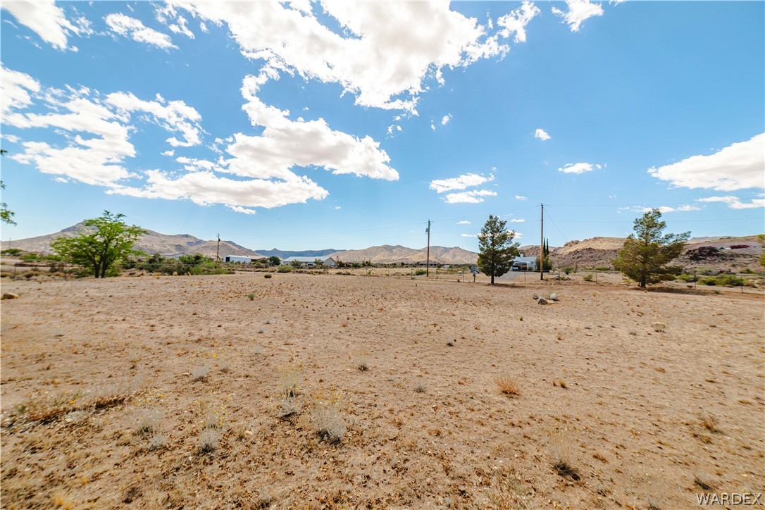 2100 East Valley View Road Kingman, AZ 86409 - Photo 51 of 53 Expansive desert landscape with scattered vegetation and distant mountains