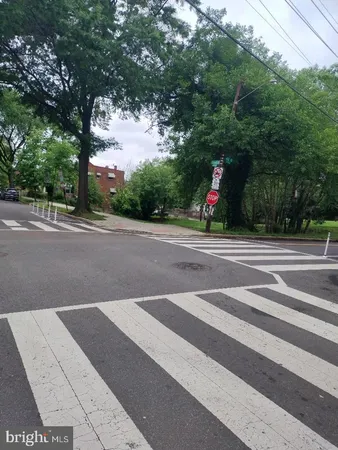 a view of a street with a building in the background