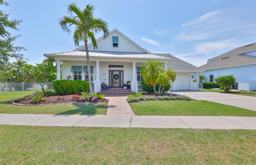 5710 Tortoise Place Apollo Beach, FL 33572 - Photo 1 of 1 a front view of a house with porch and garden