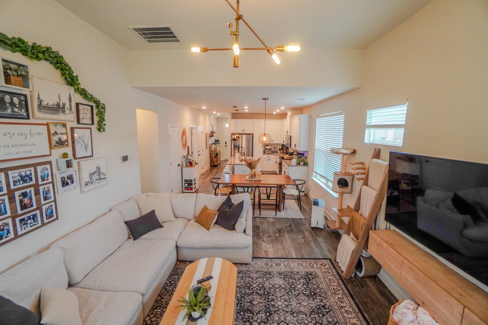 257 Breaking Pen Road Gallatin, TN 37066 - Photo 23 of 58 a living room with lots of furniture and a chandelier