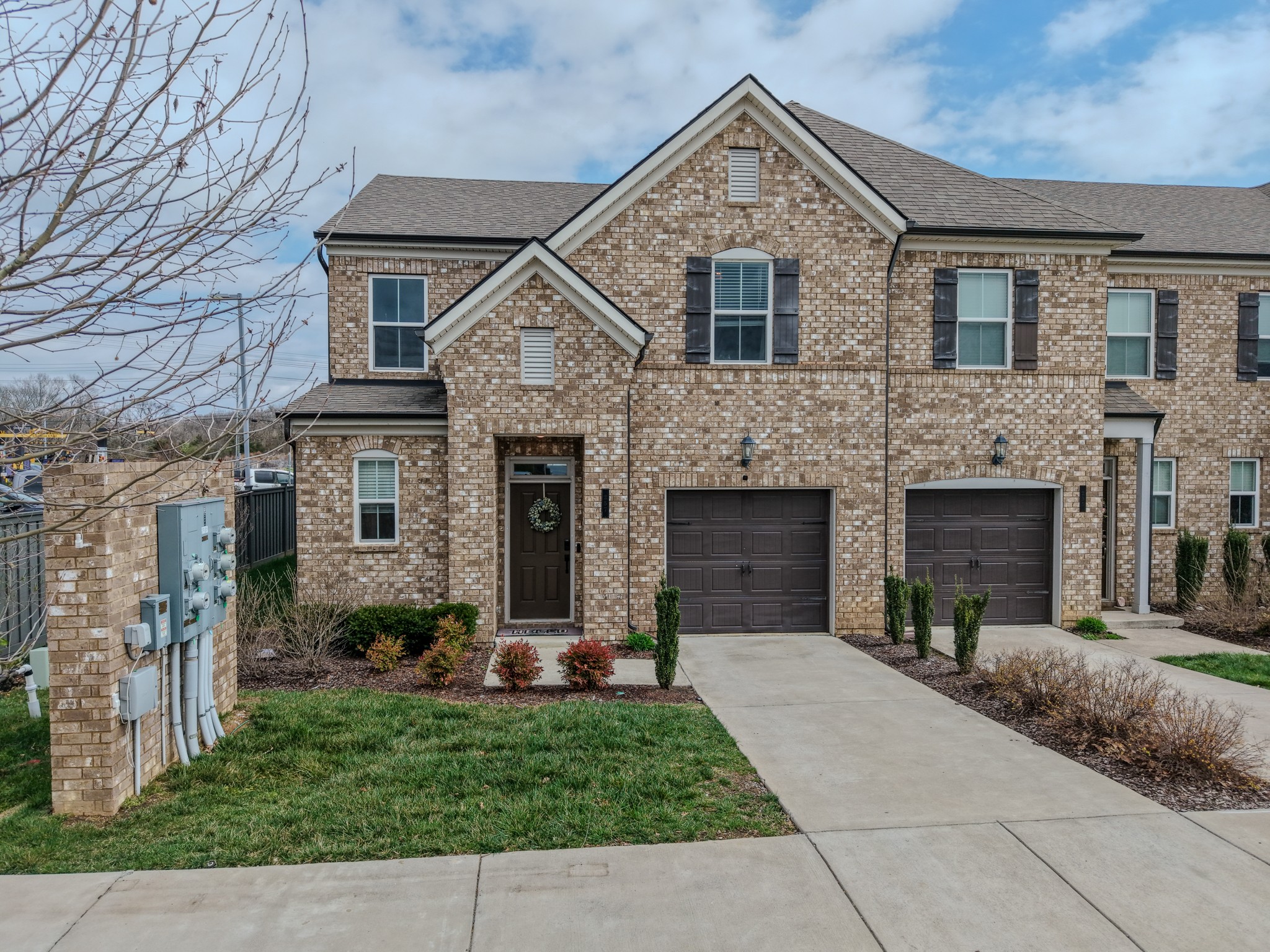 257 Breaking Pen Road Gallatin, TN 37066 - Photo 3 of 58 a front view of a house with a yard and garage