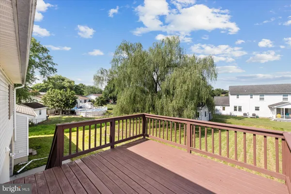 a view of a balcony with wooden floor