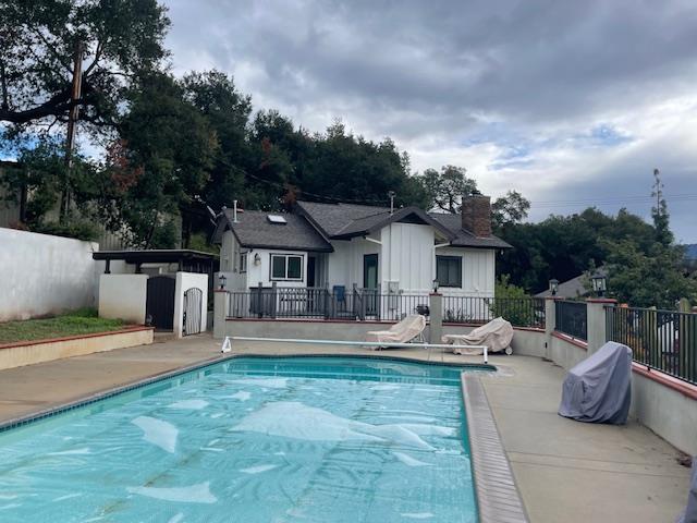 Undisclosed Address Ojai, CA 93023 - Photo 11 of 12 a front view of a house with a yard patio and fire pit